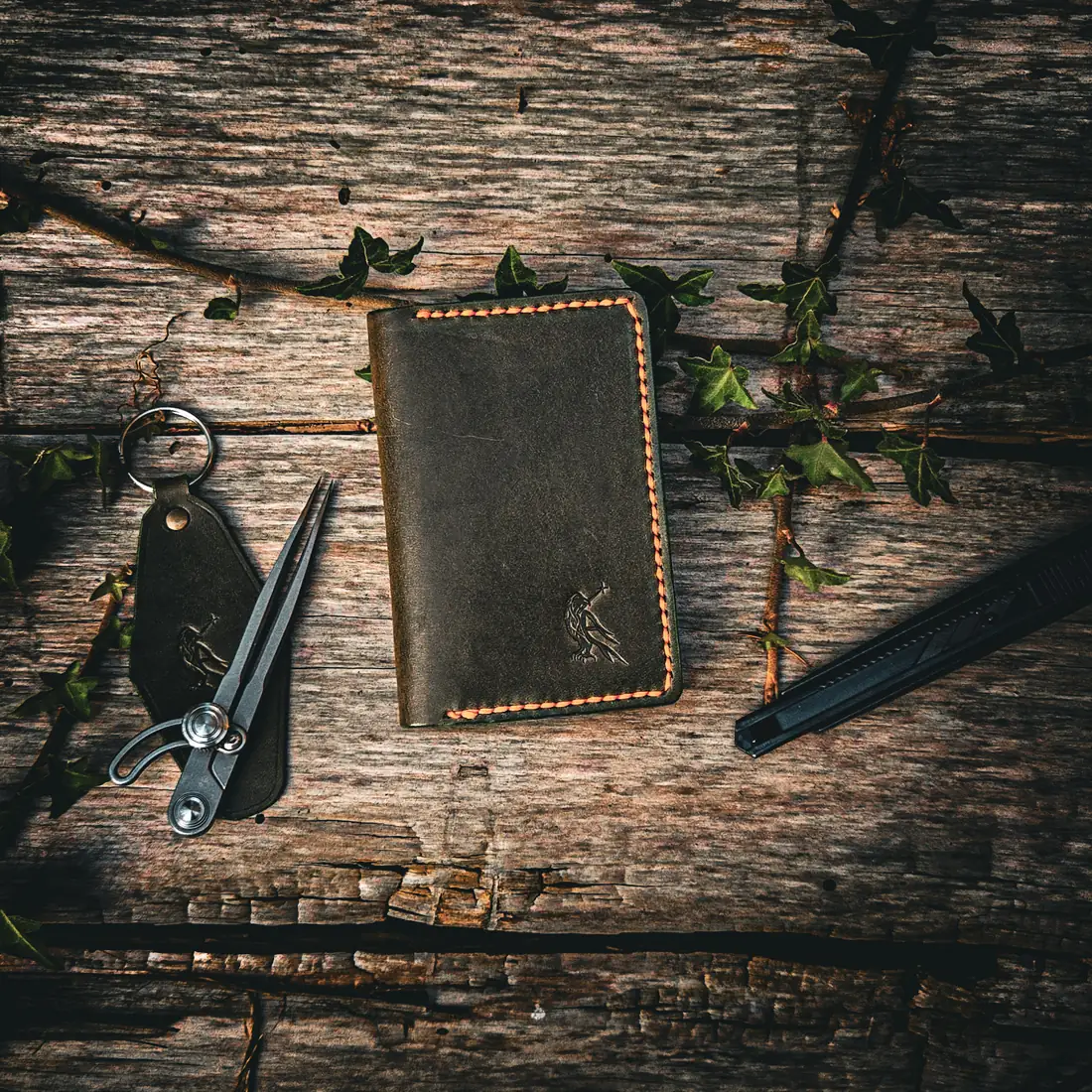 Natural leather wallet photographed on moss