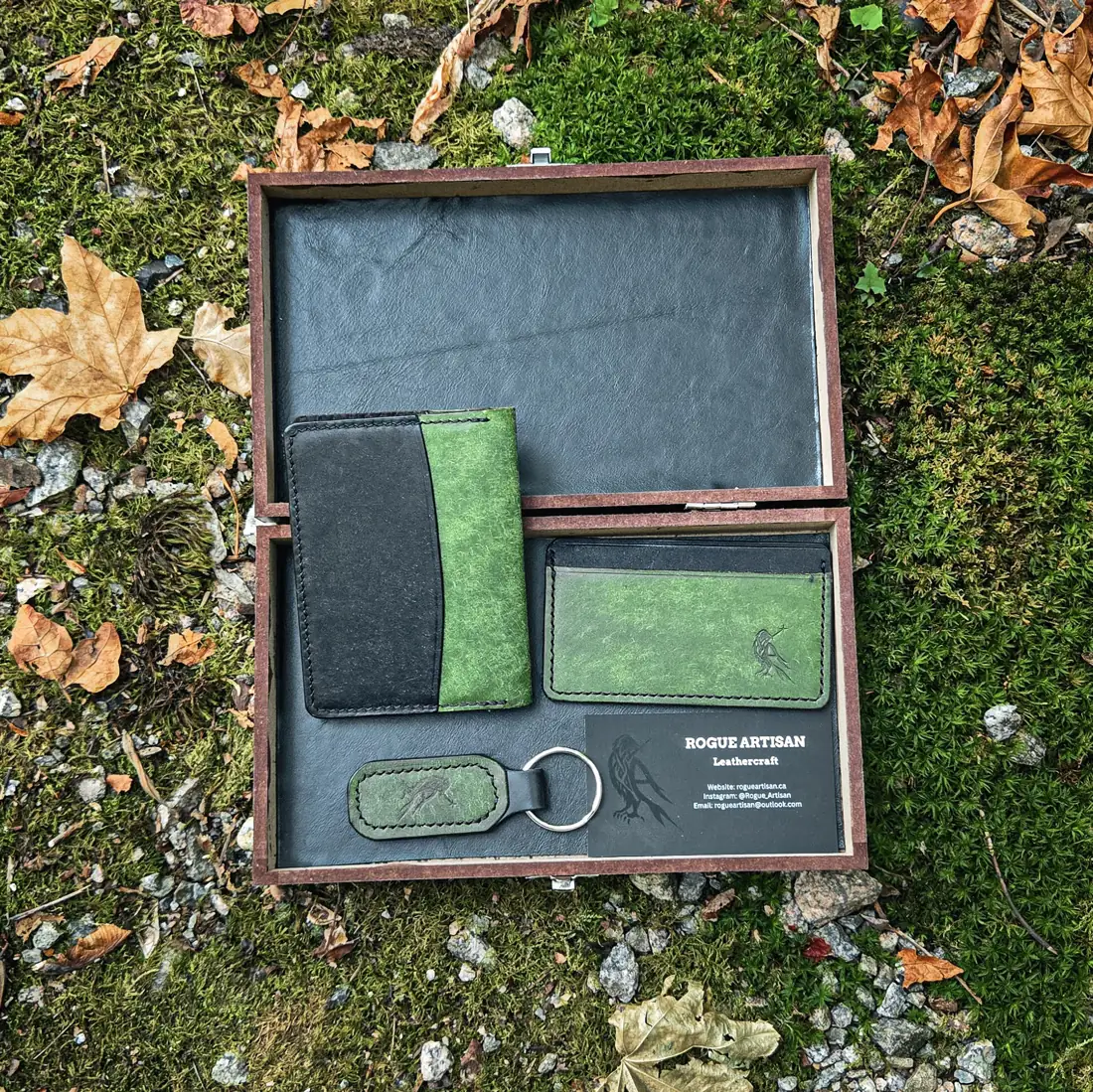 Handcrafted leather goods photographed on moss